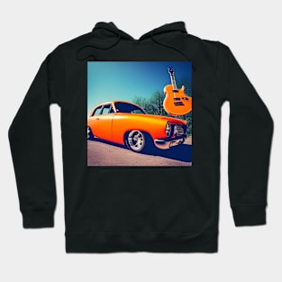 An Orange Guitar Suspended above An Orange Car Hoodie